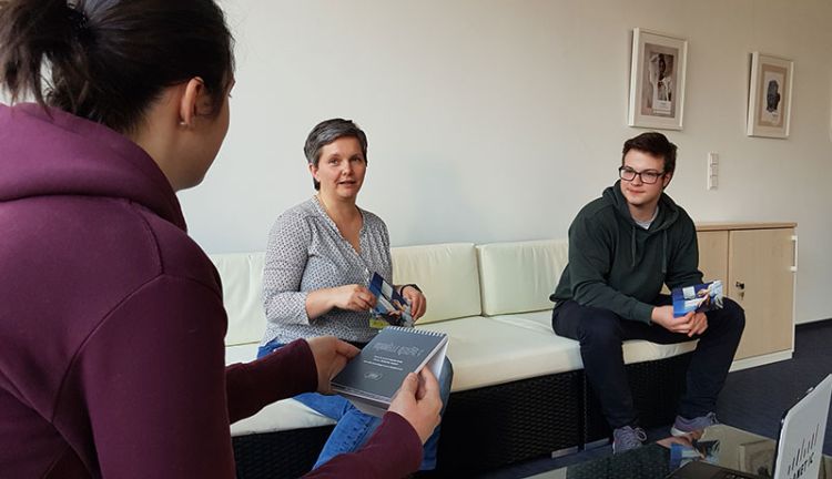 PLANET IC Desginteam Mitglieder des PLANET IC Designteam sitzen in einer Besprechung